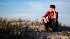 Man struggling with self-doubt