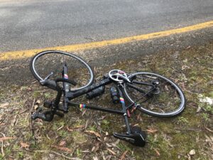 A bike lying on the side of the road