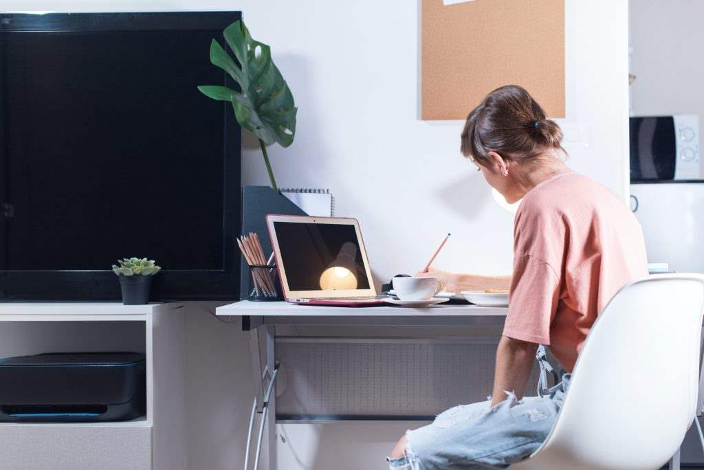 Woman sitting working from home