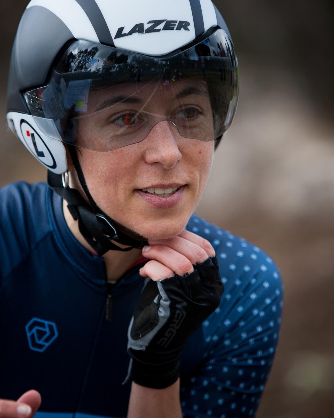 Performance psychologist Melbourne with cycling helmet reflecting lived experience of performance environments