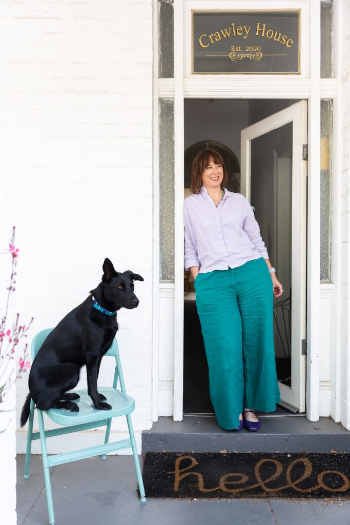 Reintroducing myself - Nonie Carr, Counselling Psychologist, at Crawley House in Albert Park, Melbourne, with her black Kelpie Bindi